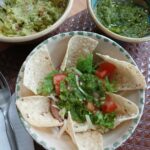 Refried bean bowl with jalapeño salsa and guacamole